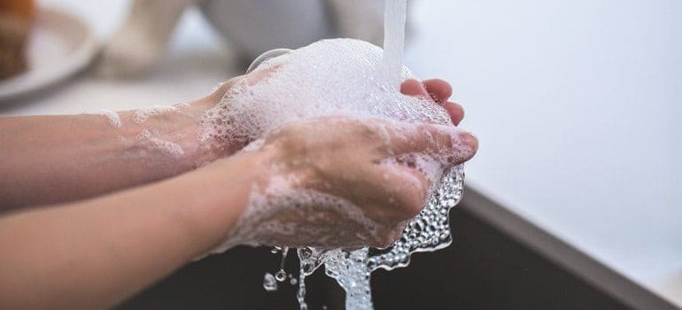 A person washing hands