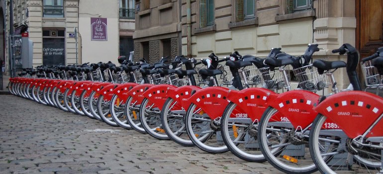 A row of red bikes from city renting station 