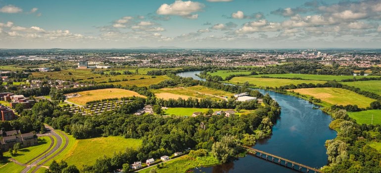 Ariel view of the town, fields, and river. 