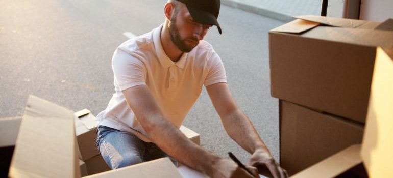 a guy delivering boxes