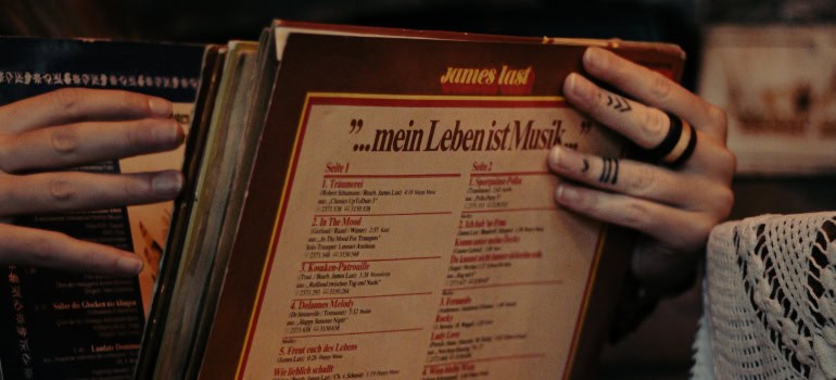 A person packing vinyl records for the move