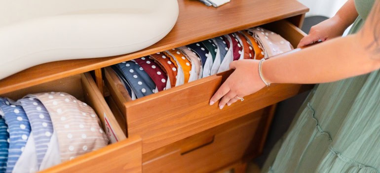 woman folding clothes