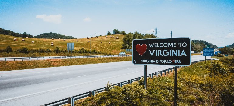 A welcome to Virginia sign on the road