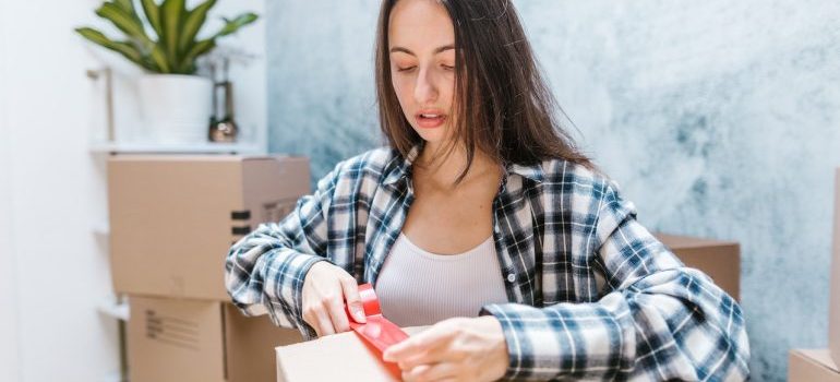 A girl packing a box