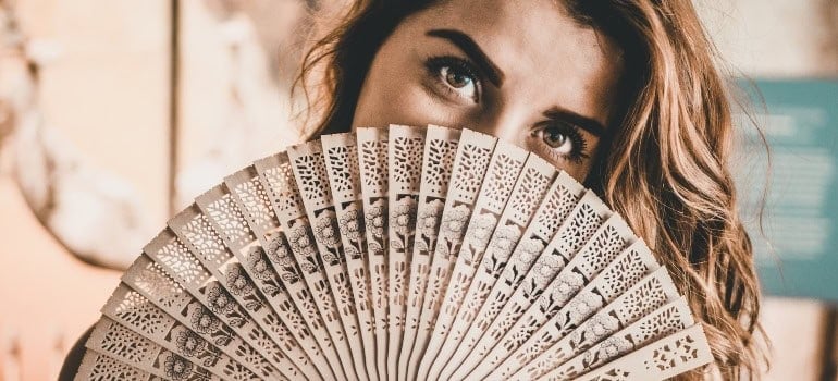 Picture of a woman with a fan