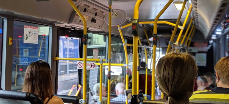 People sitting on a public bus.