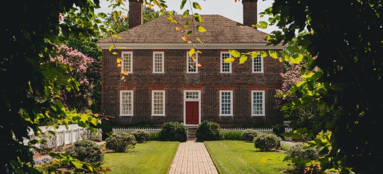 A large home with a beautiful yard.