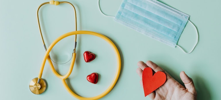 A yellow stethoscope representing healthcare which is something to consider when making a family move from Springfield to Reston. 