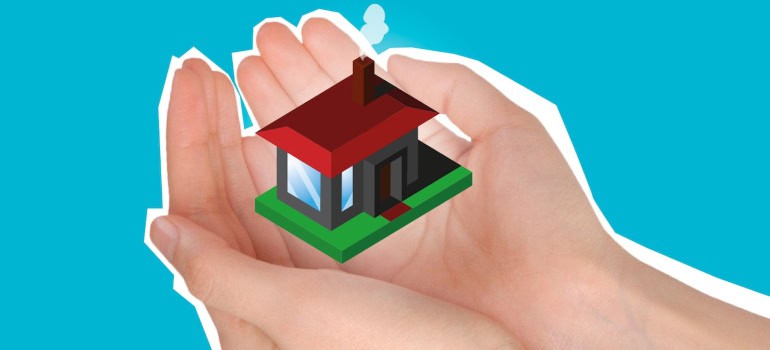 an illustration of a tiny home being held by a pair of hands