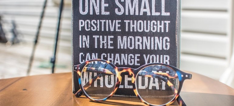 a board with a quote praising positivity