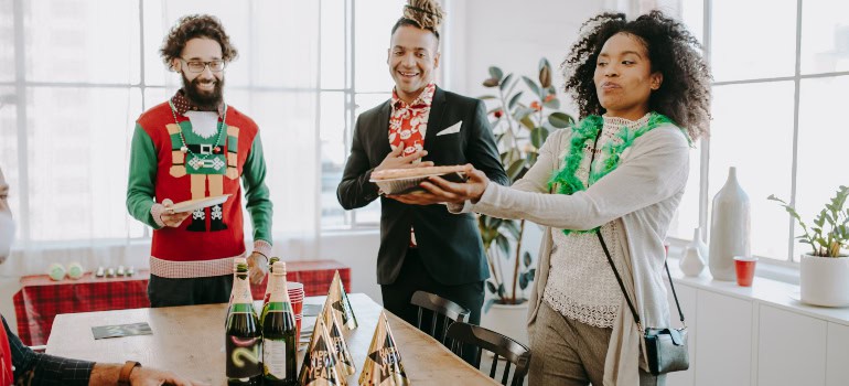 three people attending an office party