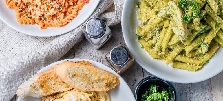 three Italian dishes on a table viewed from above