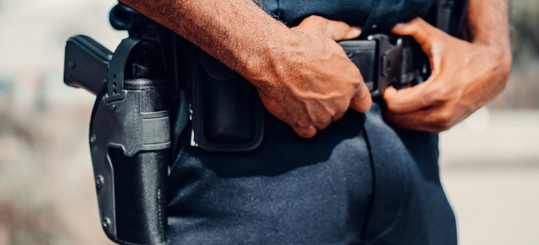 a police officer with a gun in his holster