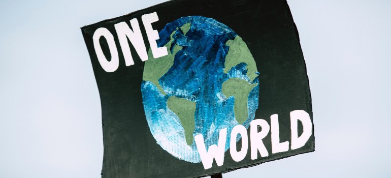 a poster with planet Earth on it and the inscription that says "one world"