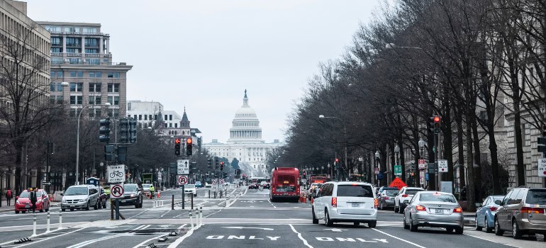 a street in Washington DC with the Capitol in the background