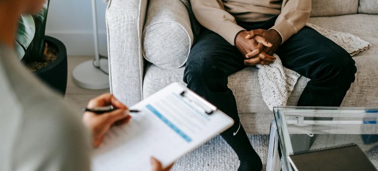 a man at therapy, which is something to consider if you want to help a hoarder move