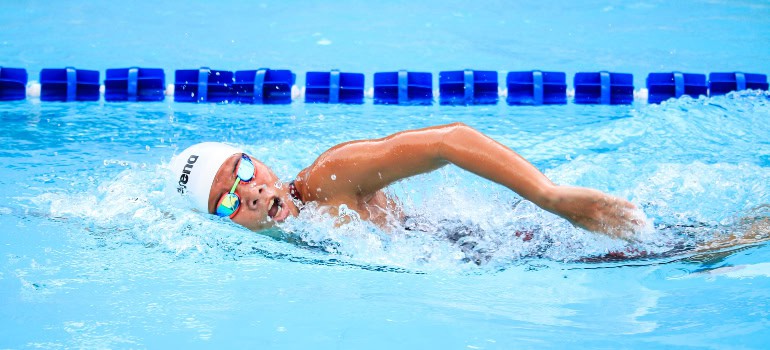 a person swimming at a swimming race