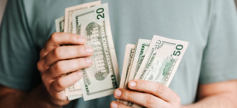 a man counting his money and wondering how to find a dream home in Woodbridge