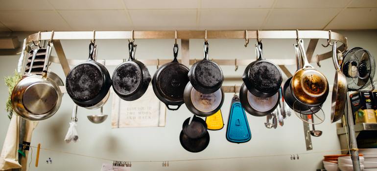 an assortment of frying pans which is something to consider when you need to pack your kitchen for the move