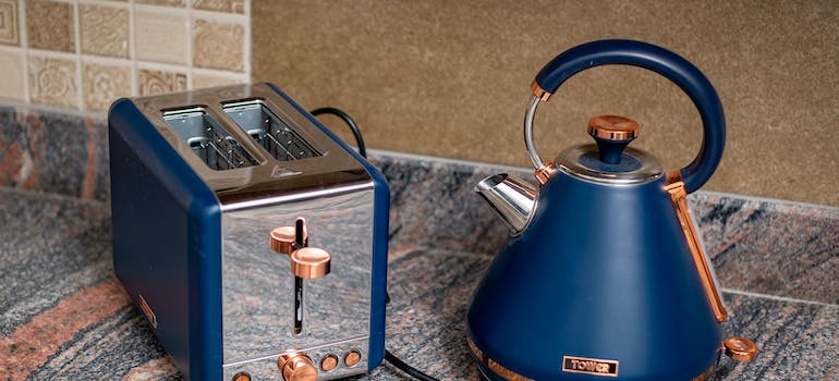 a blue toaster and a kettle