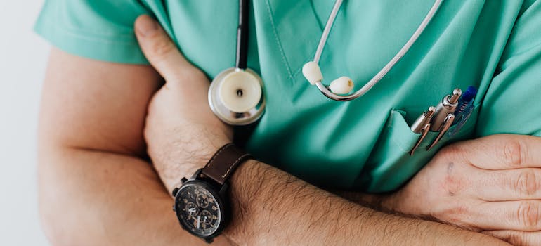 a doctor in green scrubs