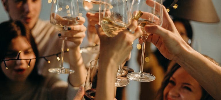 people toasting with champagne glasses