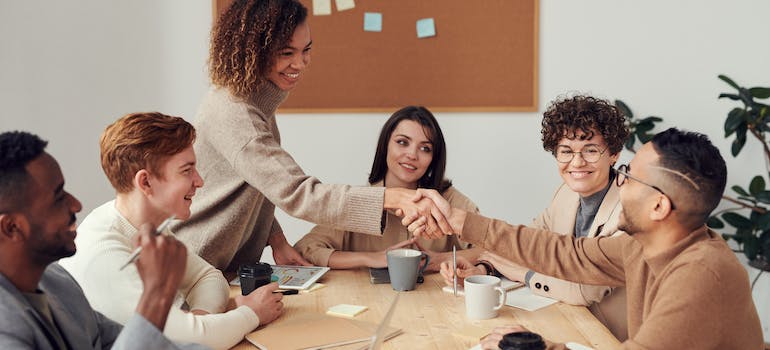 a group of people getting to know each other at a meeting