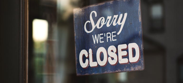 a sign on a door that says "Sorry we're closed" you might encounter when moving during the holiday season