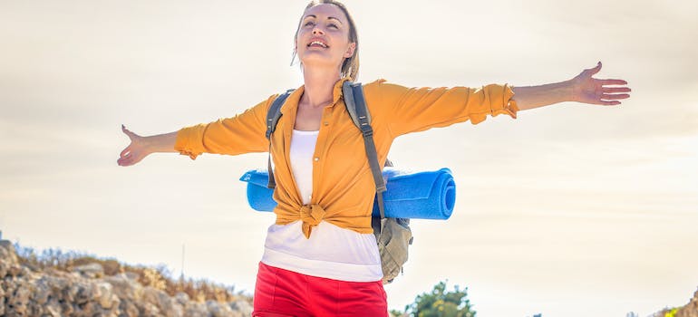 a woman hiking and apparently enjoying it