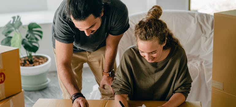 two people checking whether something didn't get lost in transport which is unlikely to happen when choosing furniture removal services