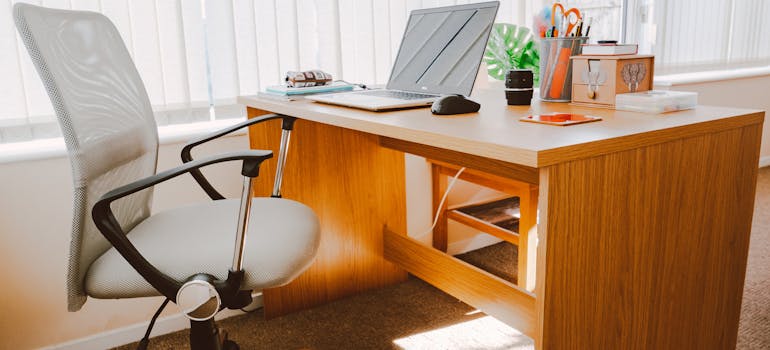 a tidy desk with a laptop on it