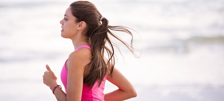 a woman jogging in a pink top