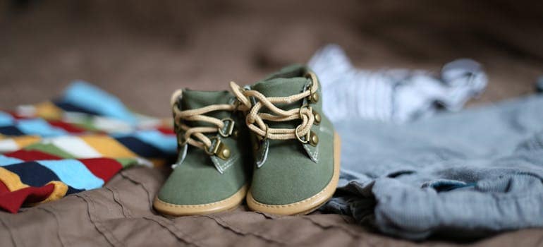 a pair of tiny, green shoes