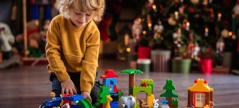 a boy playing with Lego