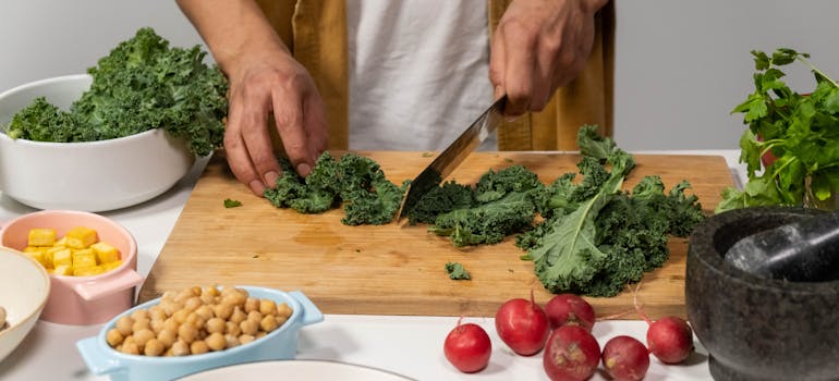 a man cutting up some vegetables