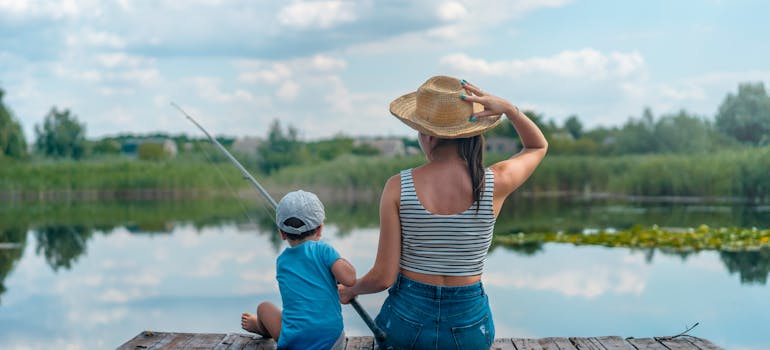 a woman and a little boy fishing while camping in Northern Virginia