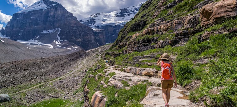 a woman hiking through a beautiful landscape