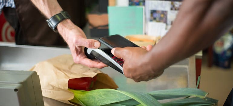 a person paying for their groceries