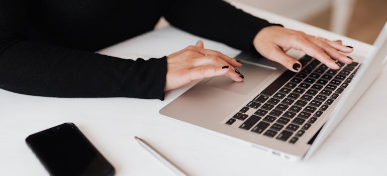 a woman surfing the internet on her laptop